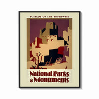 Framed Southwest pueblo cliff dwellings print shown as a bold statement piece on a clean gallery wall