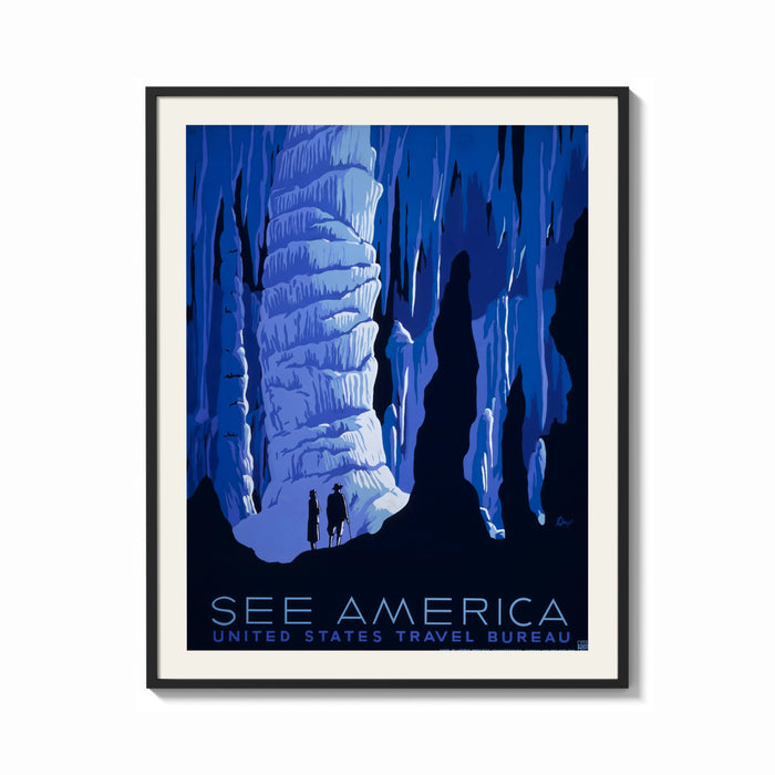 Framed Cave stalactites with two tourists print shown as a bold statement piece on a clean gallery wall