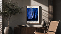 Cave stalactites with two tourists poster framed above a fluted sideboard beside an olive tree