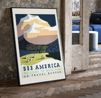 Snowy mountain with Native American camp print in a black frame leaning beside a vintage door on parquet