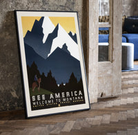 Cowboy on horse viewing mountains print in a black frame leaning beside a vintage door on parquet