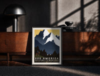 Black-framed Cowboy on horse viewing mountains print on a moody console with designer coffee-table books