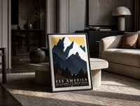 Cowboy on horse viewing mountains print in a black frame leaning on a travertine table in a sunlit lounge