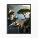 Yellow Porsche 911 sports car driving on curved coastal road with Mediterranean sea and cliffs