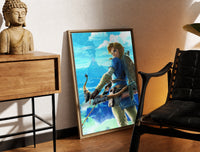 Brass-framed Elf warrior holding bow and arrow print leaning in a warm styled corner by a sculpture