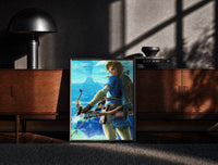 Black-framed Elf warrior holding bow and arrow print on a moody console with designer coffee-table books