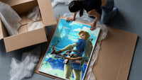 Elf warrior holding bow and arrow framed print being unpacked from protective bubble wrap and a box