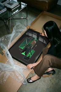 Zoro warrior anime print with emerald flames laid flat beside a brown shipping tube